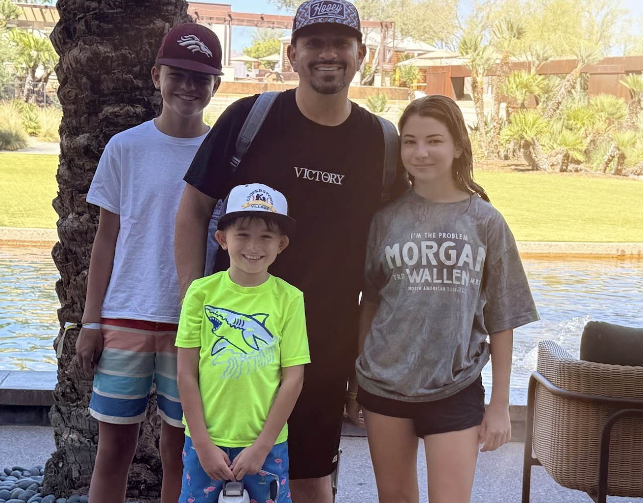 Scott Salkin with his three kids by a resort pool in Arizona
